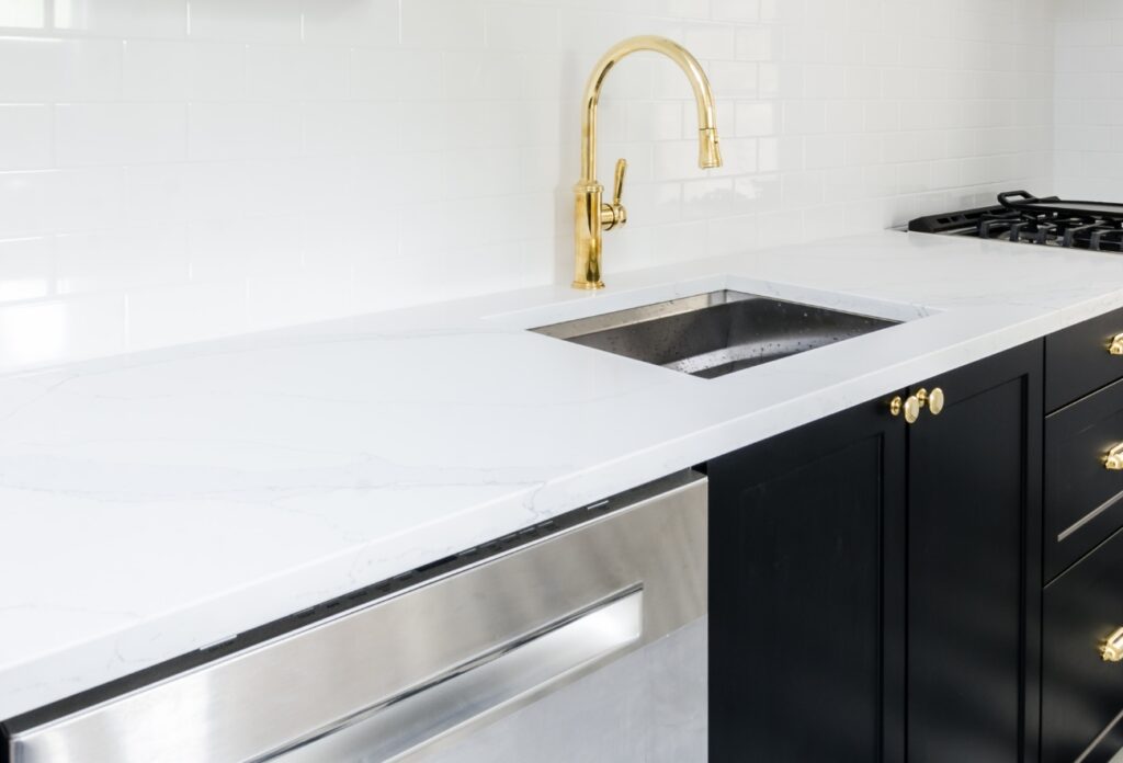 black cabinets, marble countertops, cooking space, white countertops, white cabinets, black walls, black cupboards, white marble, dark kitchens, modern design, cabinets black, black kitchen ideas, black kitchens, gold accents, wall black, white wall, white accents, color scheme, black kitchen design
