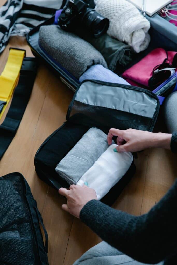 suitcase packing cubes and compartments, hand luggage, personal item, domestic travel, frequent flyer, one bag, best suitcase, best suitcase, extra space in overhead bin, many airlines, extra stability, extra cost, spend hundreds