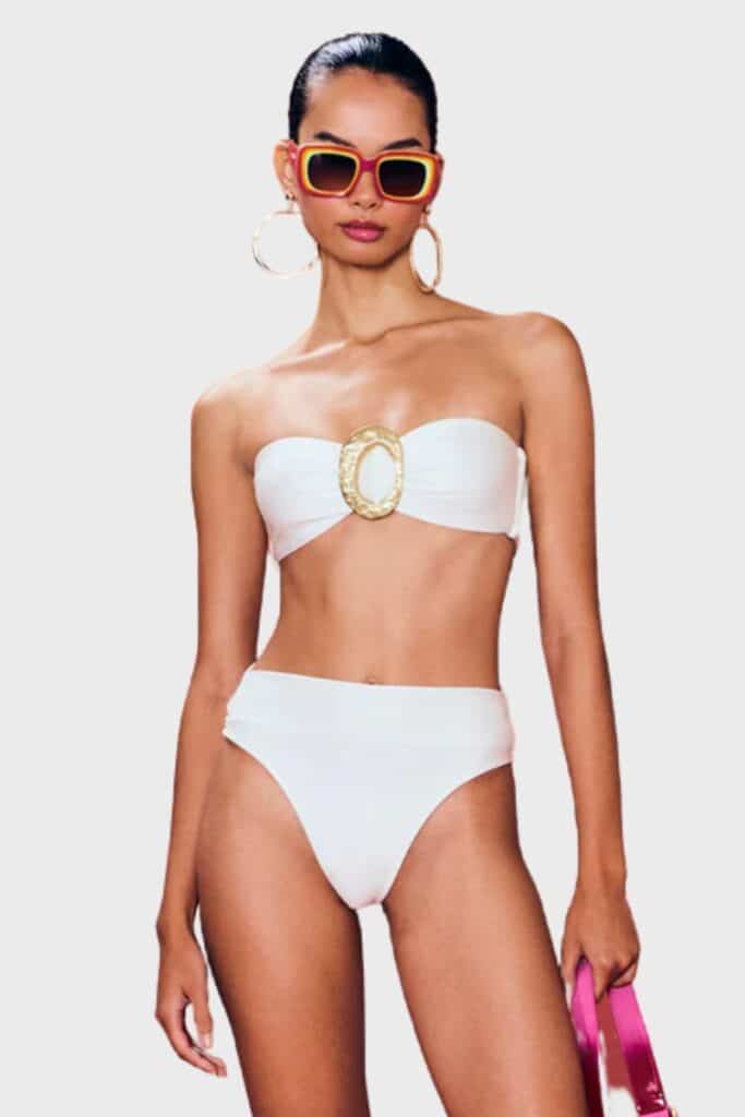 cult gaia aradhya bikini top lounge on pebble beaches at no extra cost, perfect for summer months